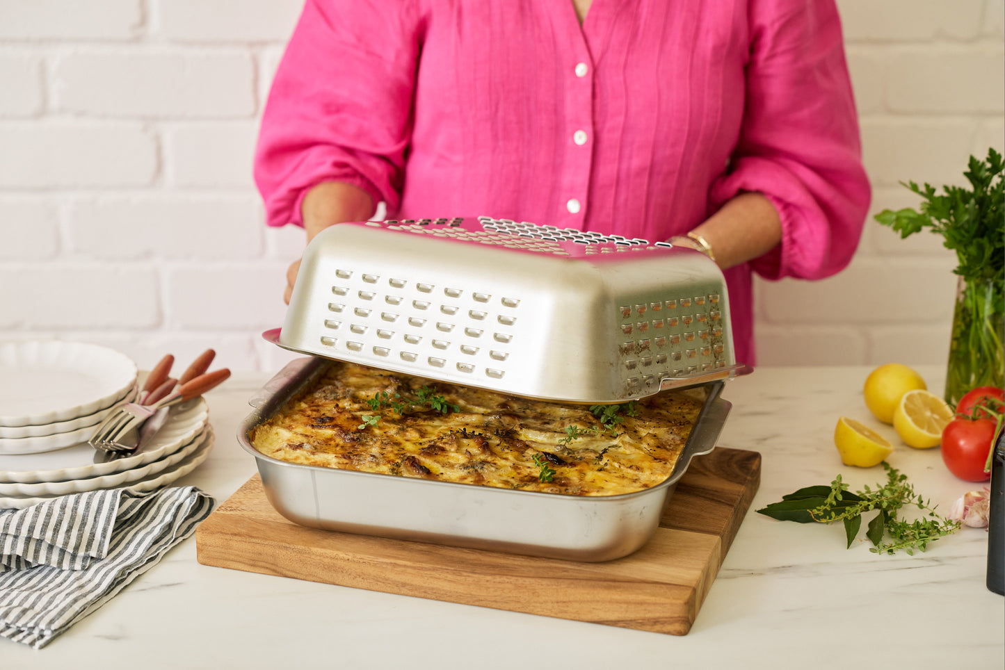 Stainless steel roasting pan by Hagane Home. The Ultimate Roaster is redefining roast night. It cooks a golden, juicy Sunday Roast and keeps the oven clean, making roast night effortless.