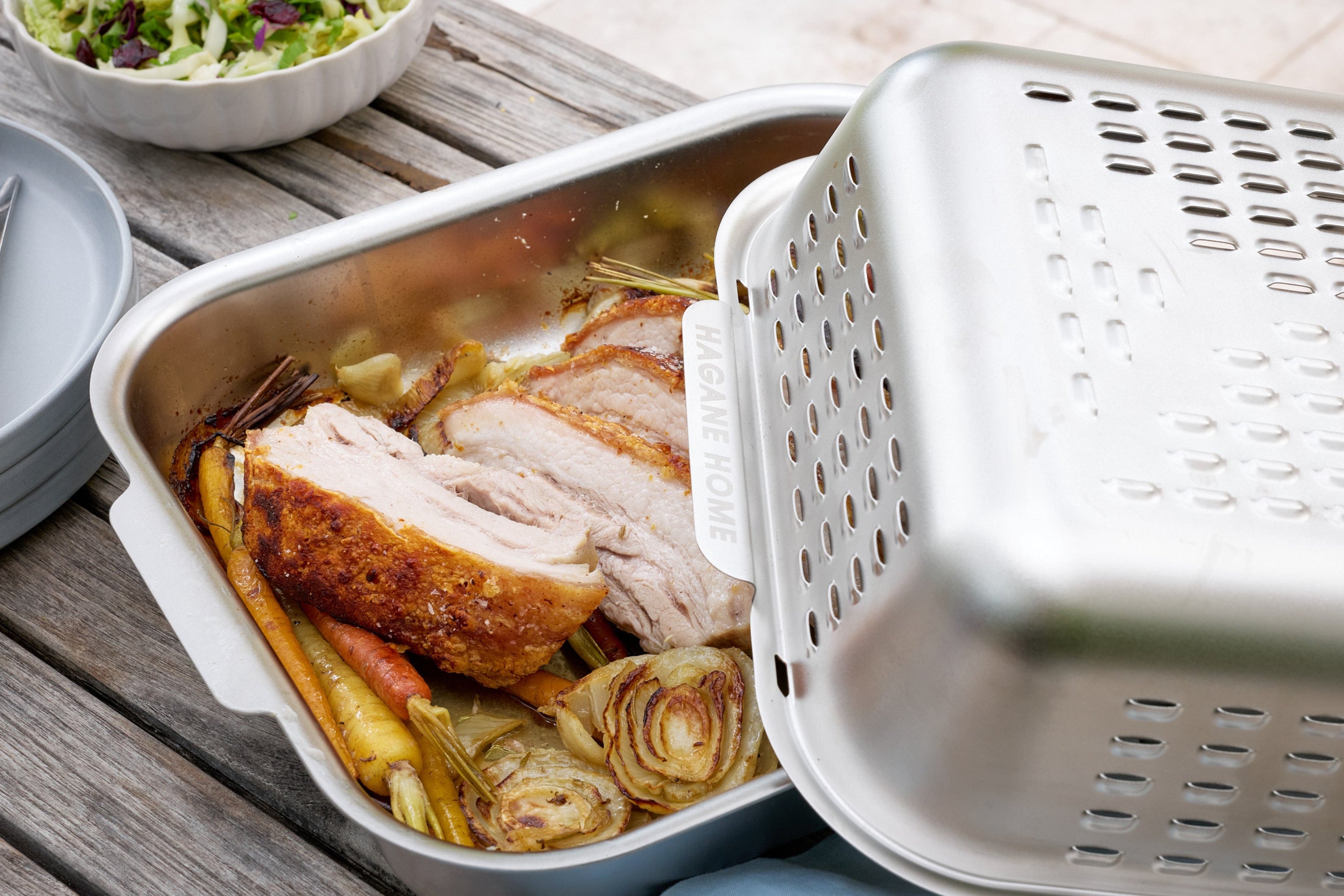 Crispy crackling on Pork Belly roasted in the Ultimate Roaster. Golden, juicy roast for Sunday Roast.