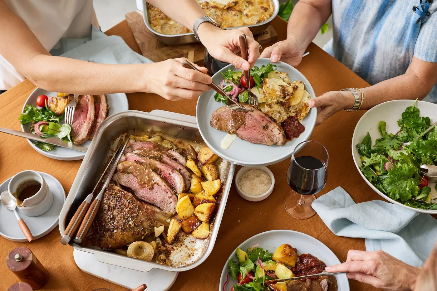 Sitting down to beef roast and crispy potatoes for Sunday roast. Roast dinner cooked to perfection in the Hagane Home Ultimate Roaster stainless steel roasting pan with vented spatter guard lid.