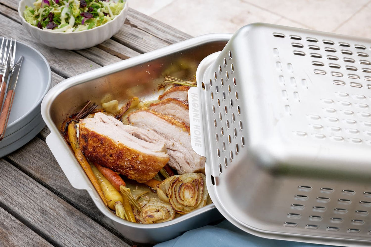 Hagane Home Ultimate Roaster is a stainless steel roasting pan with a world-first vented spatter guard lid that cooks a golden, juicy roast and keeps the oven clean. Crispy Pork Belly. Zero oven mess even after the messiest roast night. 