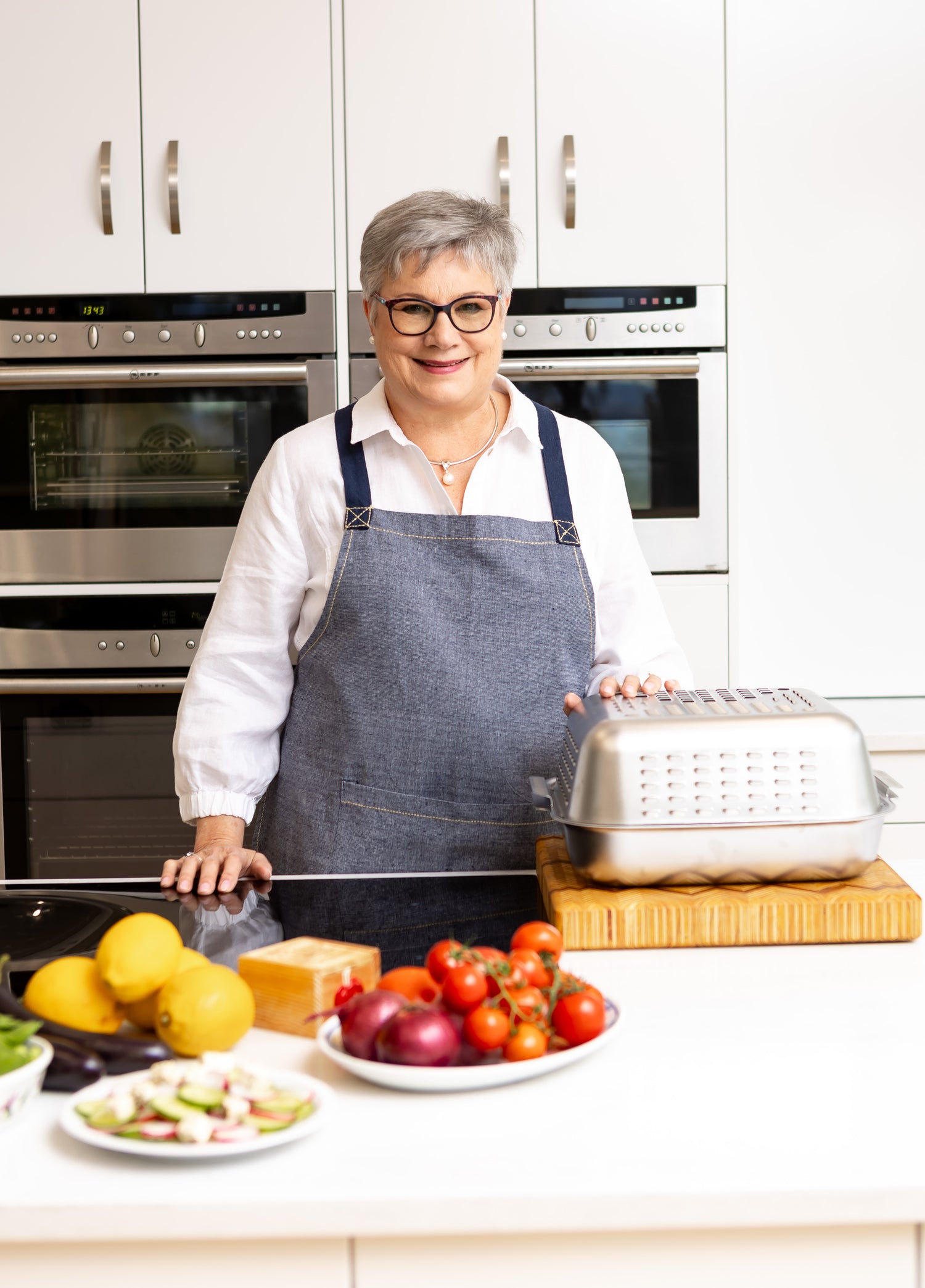 At almost 70, Louise invented a No Mess Roasting Pan. Stainless steel roasting pan with vented spatter guard cover that creates the perfect roast and keeps the oven clean.