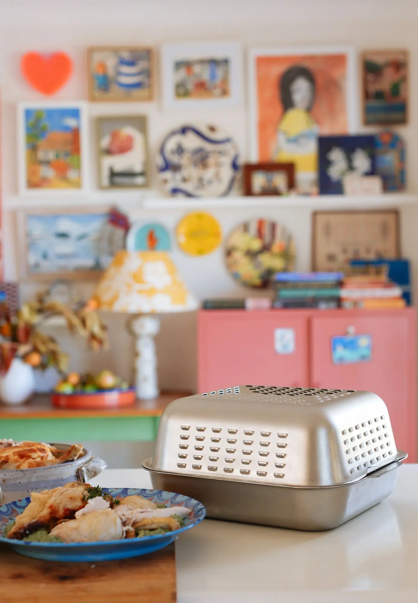 Ultimate Roaster cooks a deeply golden and incredibly juicy roast chicken in Sophie Hansen's kitchen. Stainless steel roasting pan with world-first vented spatter guard cover.