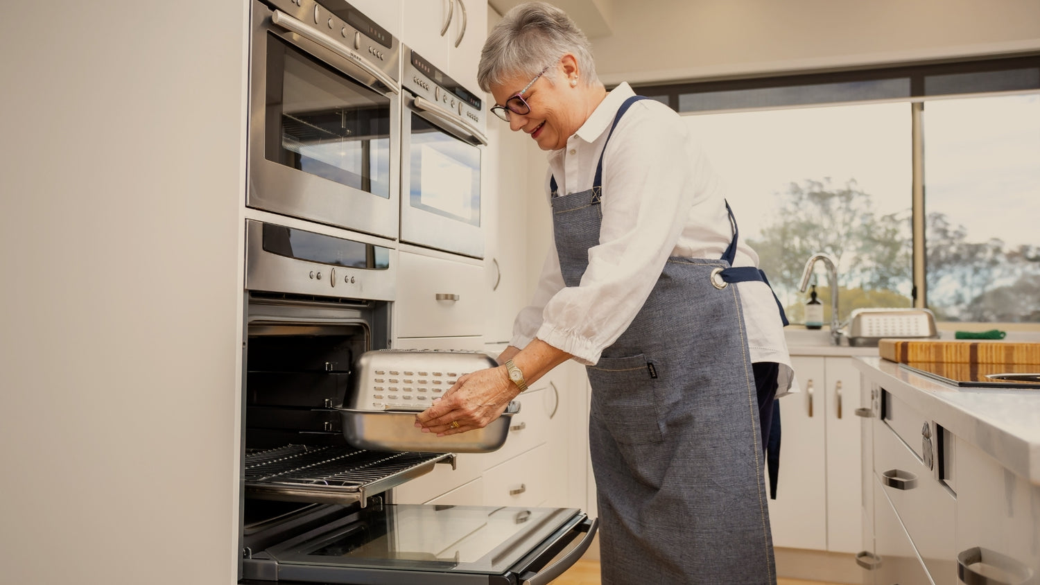 Taking the Hagane Home Ultimate Roaster out of the oven. The clever vented spatter guard cover keeps the oven clean and cooks a perfectly golden, juicy roast. Crafted from premium triply stainless steel and made to last a lifetime. Designed to bring back the joy of roast night.
