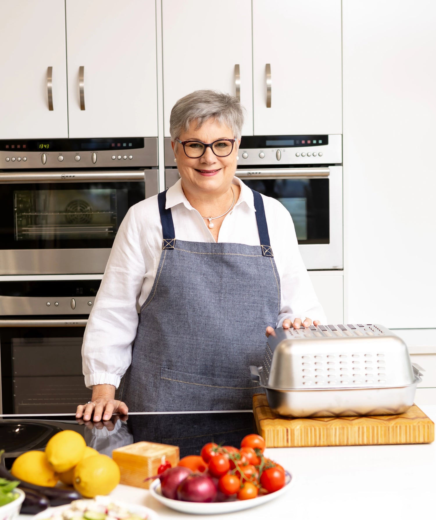 At almost 70, Louise invented a No-Mess Roasting Pan. Premium stainless steel roasting pan with vented spatter guard cover that creates the perfect roast and keeps the oven clean.