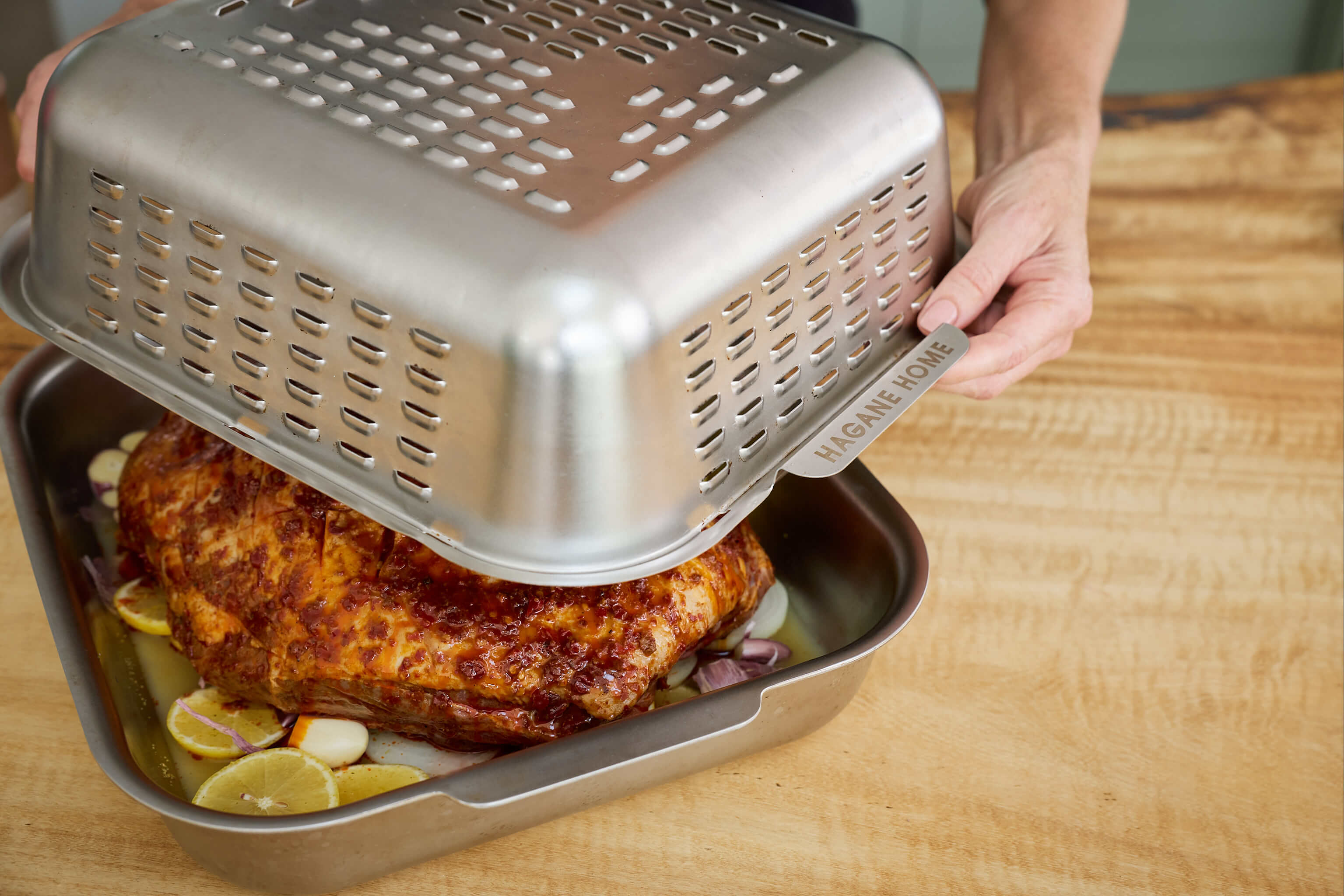 The Ultimate Roaster's vented spatter guard lid keeps your oven clean and cooks a golden, juicy roast. Crafted for a lifetime of roast nights.