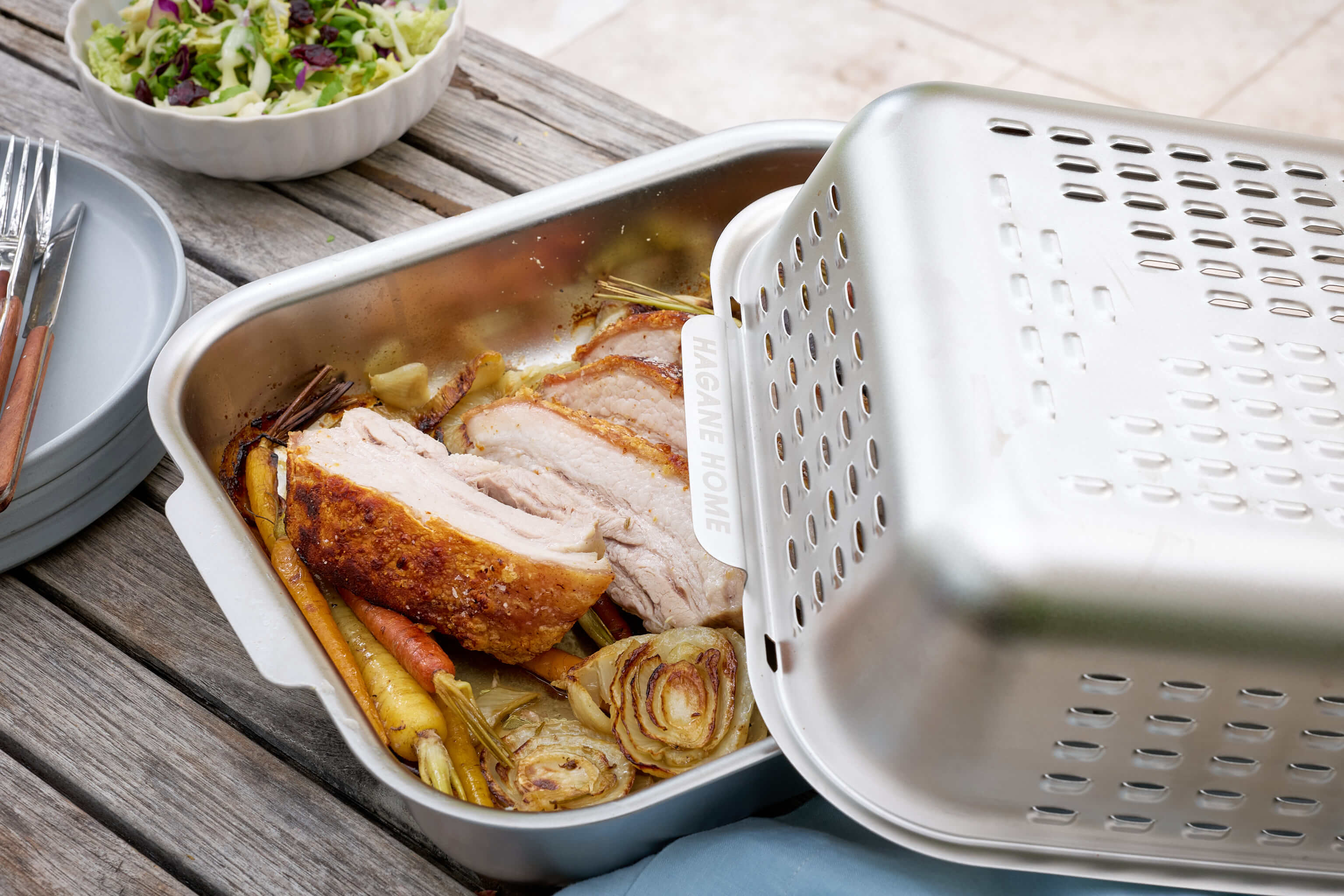 Crispy pork belly cooked to perfection in the Hagane Home Ultimate Roaster. Game-changing roasting pan with stainless steel vented spatter guard cover.